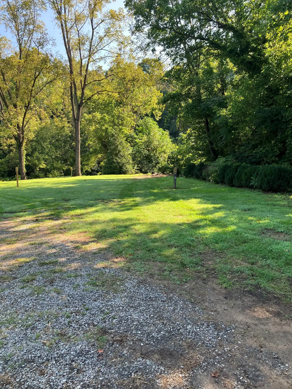 Shaded riverfront area at the park