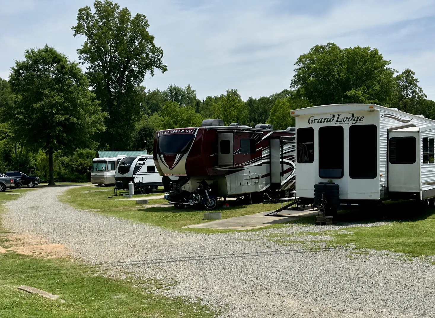 RV guests enjoying shaded full-hookup sites